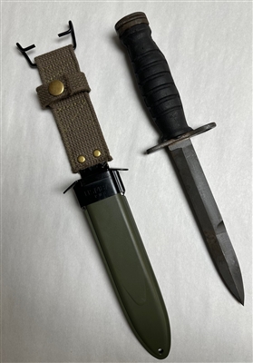 M1 CARBINE M4 KOREAN RUBBER HANDLE BAYONET WITH REPRODUCTION SCABBARD.