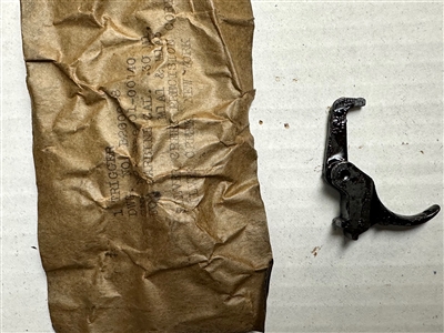 M1 CARBINE TRIGGER IN ORIGINAL WWII PACKAGE.